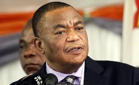 Portrait of Vice-President C. G. N. Chiwenga speaking at a podium.